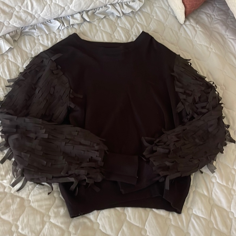Black slightly cropped sweater with fun fringe sleeves